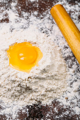 White flour with spinroll on dark background texture photo 