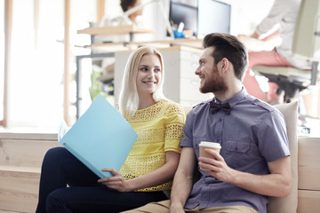 office workers with folder and coffee