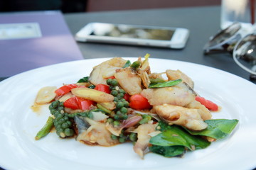 Stir-Fried Spicy Dolly Fish on Meeting Table.