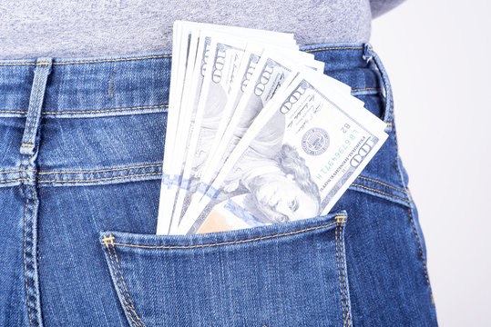 dollars sticking out of his pants pocket