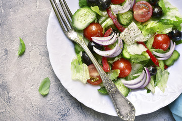 Vegetable salad with romaine lettuce,tomatoes,cucumber and black