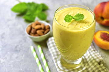 Peach and banana smoothie with almond.Space for text.
