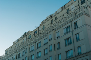 beautiful and big apartment block with white facade and very modern balconies