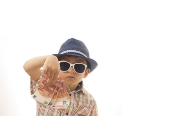 Caucasian kid with hat and sunglasses  holding euro money  in his hand. Isolated on white background. Space for copy or other design.Business concept.