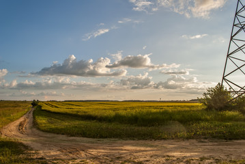 Fototapeta premium storm clouds over a green field 