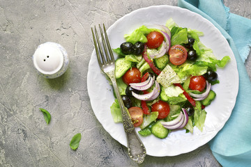 Vegetable salad with romaine lettuce,tomatoes,cucumber and black