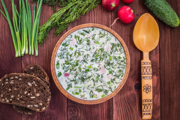 Cold soup okroshka. wooden background