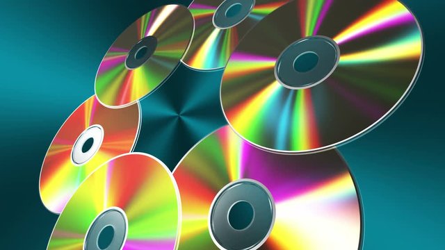 Rotating CD-DVD Discs Over Blue Background. 4K. 3840x2160. Seamless Looped 3D Animation.