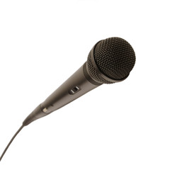 Long black studio vocal microphone with on button on body and wire isolated on white background side view closeup
