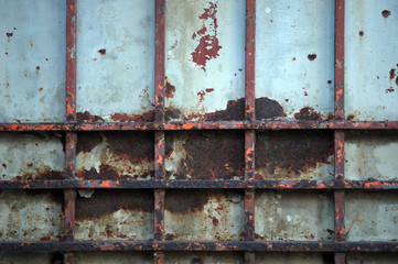 Abstract vintage steel door eroding rust.