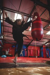 Obraz na płótnie Canvas Female karate player practicing boxing 
