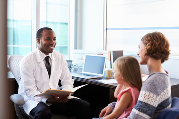 Pediatrician Meeting With Mother And Child In Hospital