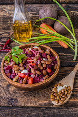 Salad Vinaigrette of beets on a wooden background. Top view