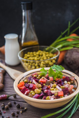 Salad Vinaigrette of beets on a wooden background. Top view