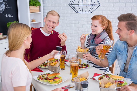 Friends eating burgers