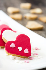 Valentine cookies with heart shape on wooden background
