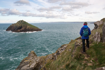 The rumps cornwall england uk, with female walker, hiker rambler. Set in the fantastic landscape...