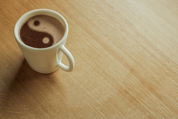A cup of black coffee as a symbol of yin yang