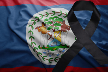 flag of belize with black mourning ribbon