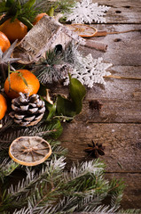 Fairy Christmas background - vintage wood, birdhouse, cinnamon, star anise, oranges, cones, snow. New Year. Top view, blank space