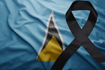 flag of saint lucia with black mourning ribbon