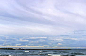 Sea waves. Cloudy weather. Baltic sea. Clouds in the sky.