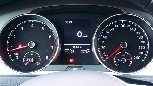 Dashboard with revolution counter and tachometer in car