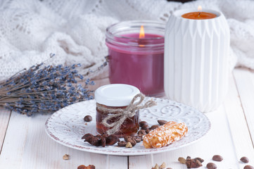 small jar with honey on a vintage saucer decorated with seeds of anise and cardamom coffee