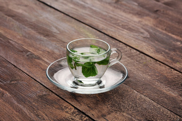 Tea. Mint Tea. Herbal leaf. leaves. Tea in a glass cup, dried, sliced lime. herbs and mint leaves on a slate plate in a restaurant or teahouse tea room.