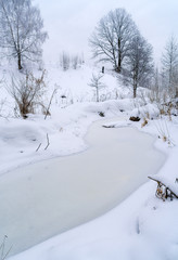 Winter landscape with frozen river