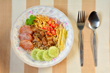 Rice Mixed with Shrimp paste with spoon and folk .