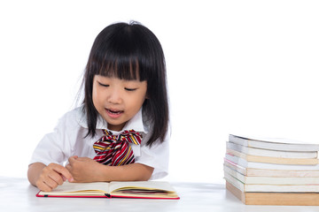 Happy Asian Chinese little girl reading book