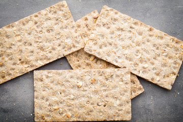Stack of wholegrain crispy bread with sunflower, chia and sesame