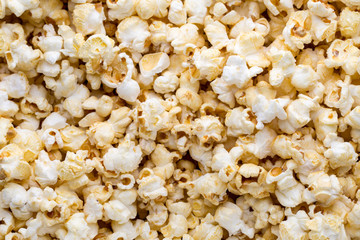 Popcorn background. Caramel sweet corn. Cinema snack.