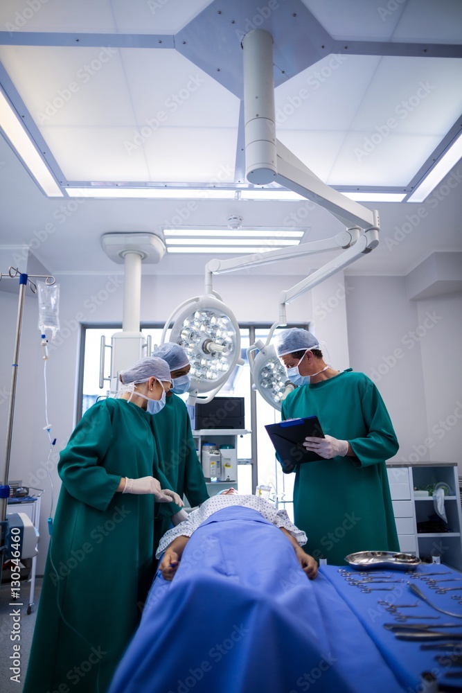 Poster surgeons performing operation in operation theater