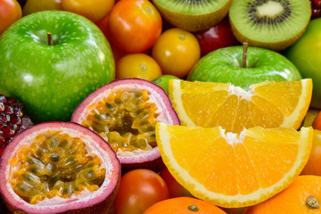 Naklejka na ściany i meble Closeup orange and passion fuits slice with group of ripe fruits