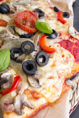 pizza with tomatoes, mushrooms, olives and peppers