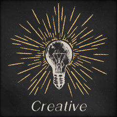 Hand drawn vector sketch illustration - creative vintage tee shirt apparel print poster design, realistic light bulb with sunburst, black chalkboard background.