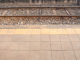 pavement and braille block of platform of railways station