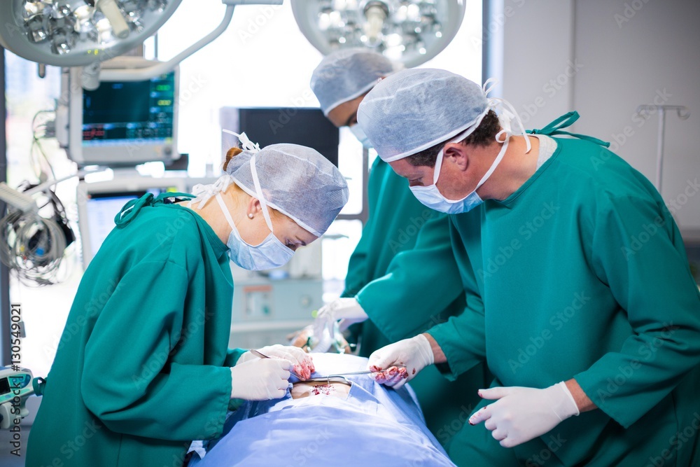 Poster surgeons performing operation in operation theater