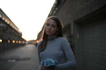 Fototapeta premium Sad girl grabs her jacket before leaving a conversation