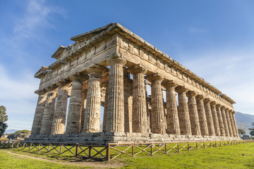 Fototapeta na wymiar Rear view of greek temple of Neptune, in the archaeological site of Paestum, Salerno, Italy