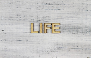 life word on a wooden background