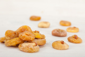 Pile of healthy, delicious dry figs over white