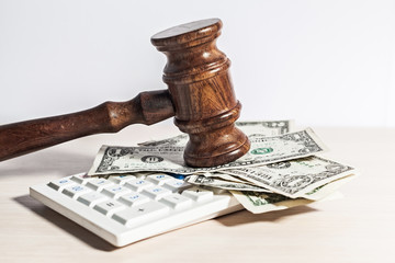 judge gavel and money on brown wooden table concept