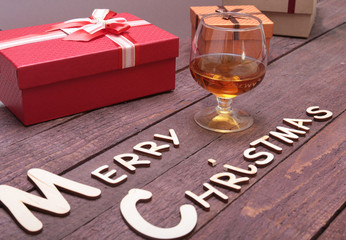 Merry christmas text and decorations on a wood background