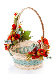 decorated empty wicker basket on a white background