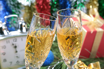 Clock and gift box on christmas background