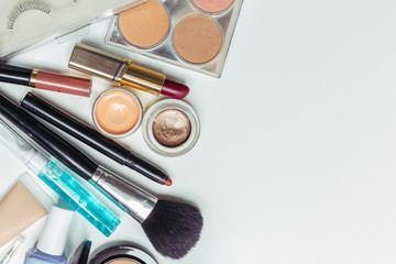 Brush and cosmetic isolated on a white background. Top view.