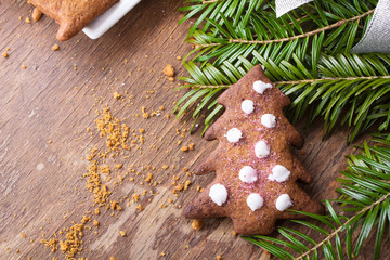 Colorful Christmas gingerbread cookies on wooden background